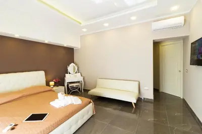 TV o dispositivi per l'intrattenimento presso Porto Rooms & Suite