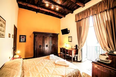 Letto o letti in una camera di San Gennaro B&B