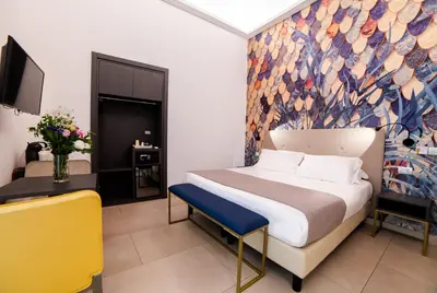 Letto o letti in una camera di B&B Napoli Time