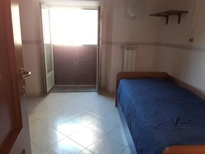 Letto o letti in una camera di CASA MARGHERITA