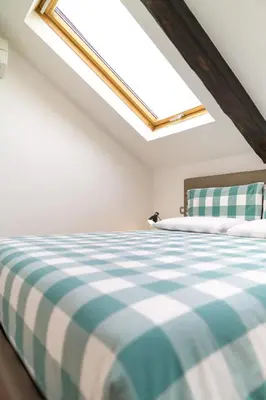 Letto o letti in una camera di Napolidays Mansarda Nicola Amore