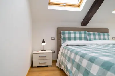 Letto o letti in una camera di Napolidays Mansarda Nicola Amore