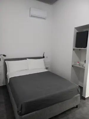 Letto o letti in una camera di Hotel Santa Brigida