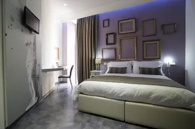 Letto o letti in una camera di Hotel Santa Brigida