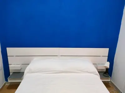 Letto o letti in una camera di La casa su SpaccaNapoli