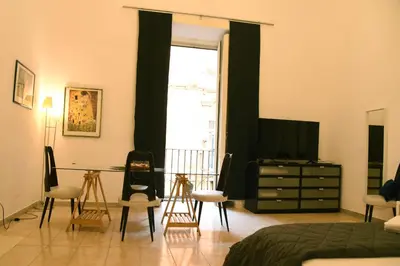 Letto o letti in una camera di Costigliola Baroque Palace Flat next MANN Museum