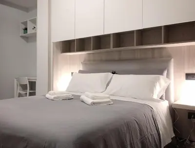 Letto o letti in una camera di Bed&Coffee Napoli - Scarlatti