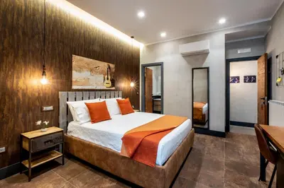 Letto o letti in una camera di casajammone naples b&b