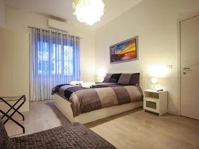Letto o letti in una camera di ChilometroZERO luxury apartment