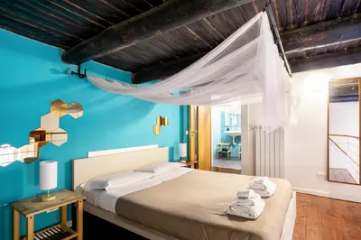 Letto o letti in una camera di Napoli Napoli Rooms