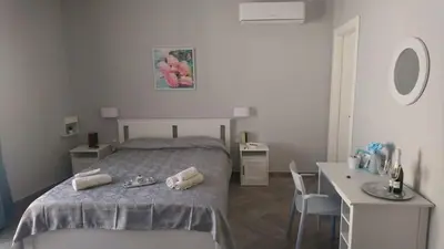Letto o letti in una camera di Soggiorno Napoletano