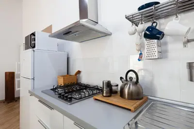 Cucina o angolo cottura di Appartamento Moderno nel centro storico
