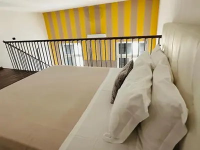 Letto o letti in una camera di Loft al Teatro San Carlo