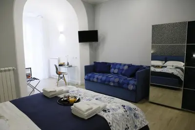 Letto o letti in una camera di Porta San Gennaro