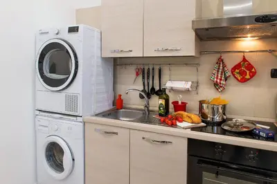 Cucina o angolo cottura di La Preziosa Apartment Duomo