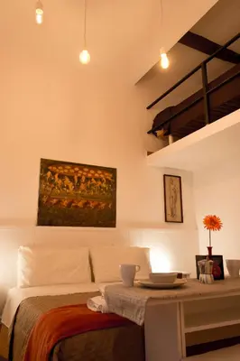 Letto o letti in una camera di Sui Tetti Di Napoli Apartment