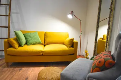 Area soggiorno di Palà Suites