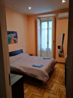 Letto o letti in una camera di Casa Cupiello Via Chiaia - Casa Vacanze ad uso Esclusivo