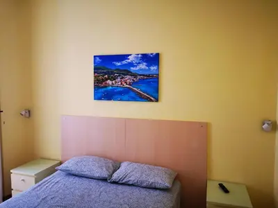 Letto o letti in una camera di Casa Cupiello Via Chiaia - Casa Vacanze ad uso Esclusivo