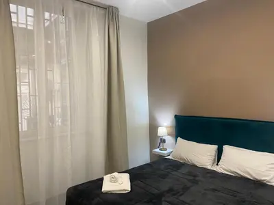 Letto o letti in una camera di Doria Suites Napoli