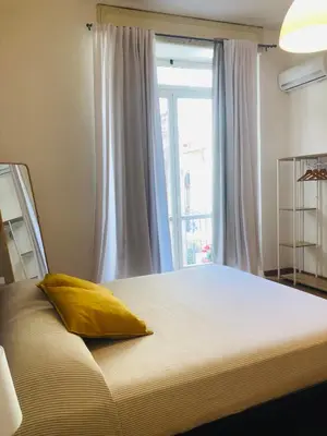 Letto o letti in una camera di Dimora Paladino