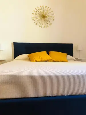 Letto o letti in una camera di Dimora Paladino