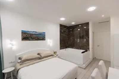 Letto o letti in una camera di MERGELLINA AMORE e FANTASIA