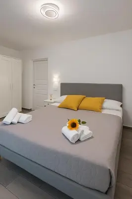 Letto o letti in una camera di NAPOLI VIBES Rooms