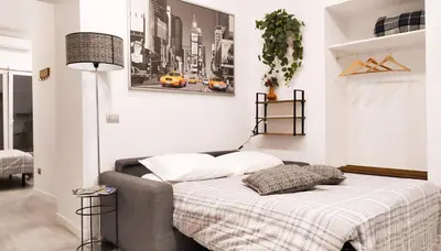 Letto o letti in una camera di It's Napoli Apartment