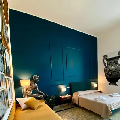 Letto o letti in una camera di MONART HOSPITALITY Cavour