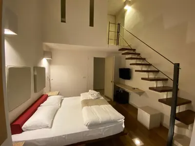 Letto o letti in una camera di Micalò Art Rooms