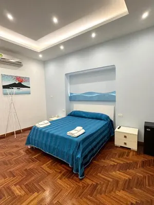 Letto o letti in una camera di SoLuMa' Chiaja Rooms