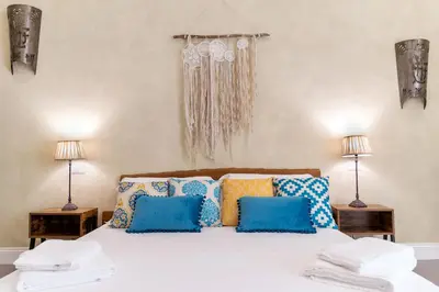 Letto o letti in una camera di HOPESTEL Secret Garden Napoli