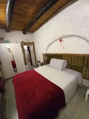 Letto o letti in una camera di La Grotta