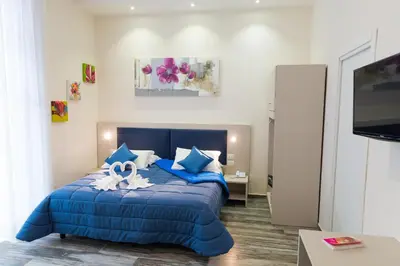 Letto o letti in una camera di Napoli's Gold