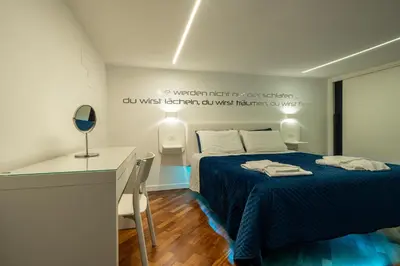 Letto o letti in una camera di Skyhouse Duomo