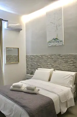 Letto o letti in una camera di Naptown Rooms