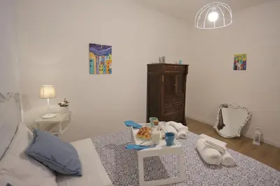 Letto o letti in una camera di Titti e Nonna
