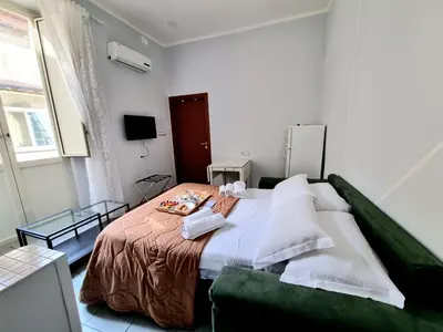 Letto o letti in una camera di DUOMO 152 NAPOLI
