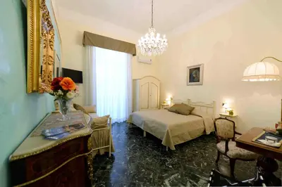 Letto o letti in una camera di B&B Residenza Via Dei Mille