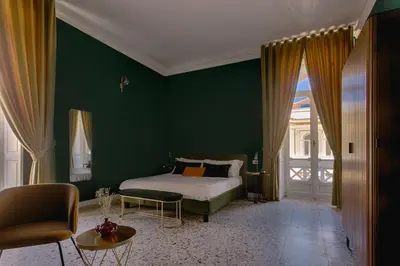 Letto o letti in una camera di Quatrum Napoli - B&B