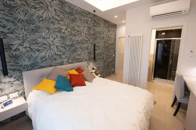 Letto o letti in una camera di Napoli City Center - Appartamenti e Camere