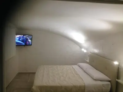 Letto o letti in una camera di Casa Vacanze Piedigrotta 57