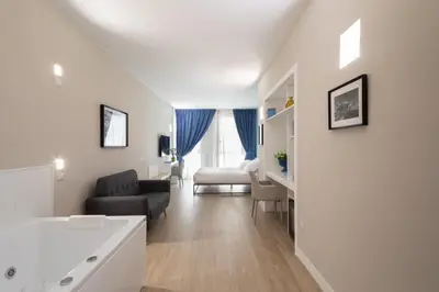 Letto o letti in una camera di Alma Suites