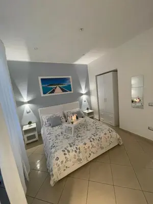 Letto o letti in una camera di HOME SWEET HOME Storia di Napoli