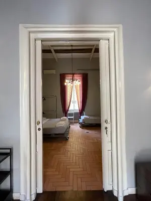Letto o letti in una camera di Anima Partenopea