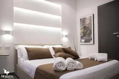Letto o letti in una camera di Megaris Luxury Suite Rooms