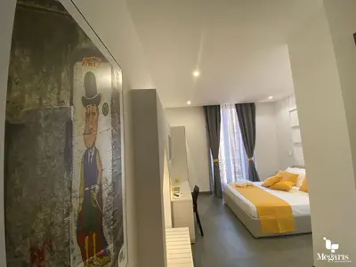 Letto o letti in una camera di Megaris Luxury Suite Rooms