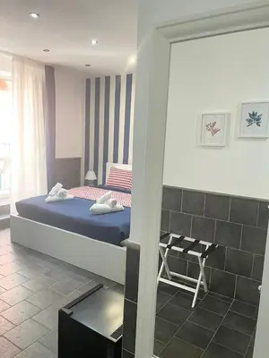 Letto o letti in una camera di Yacht Club Angioino