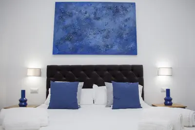 Letto o letti in una camera di Blue Plebiscito